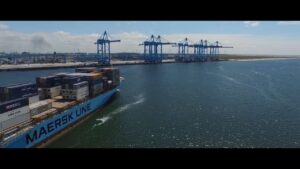 freight boat carrying shipping containers towards port